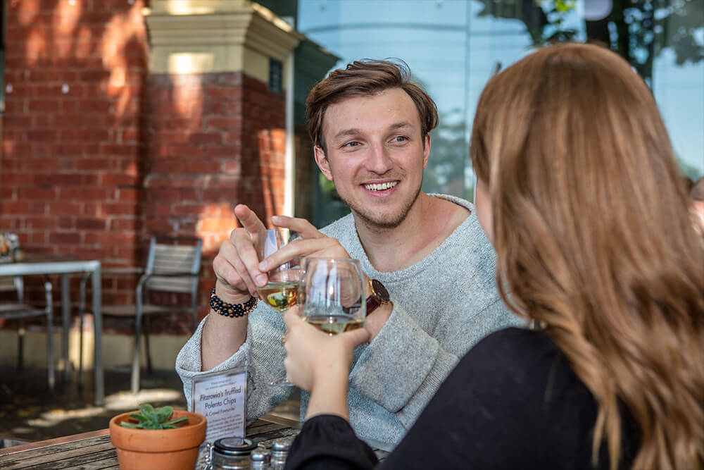 Image of hair transplant patient Daniel enjoying dinner at a restaurant